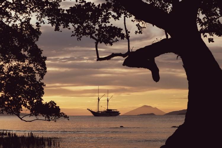 Pinisi boat anchored at sunset