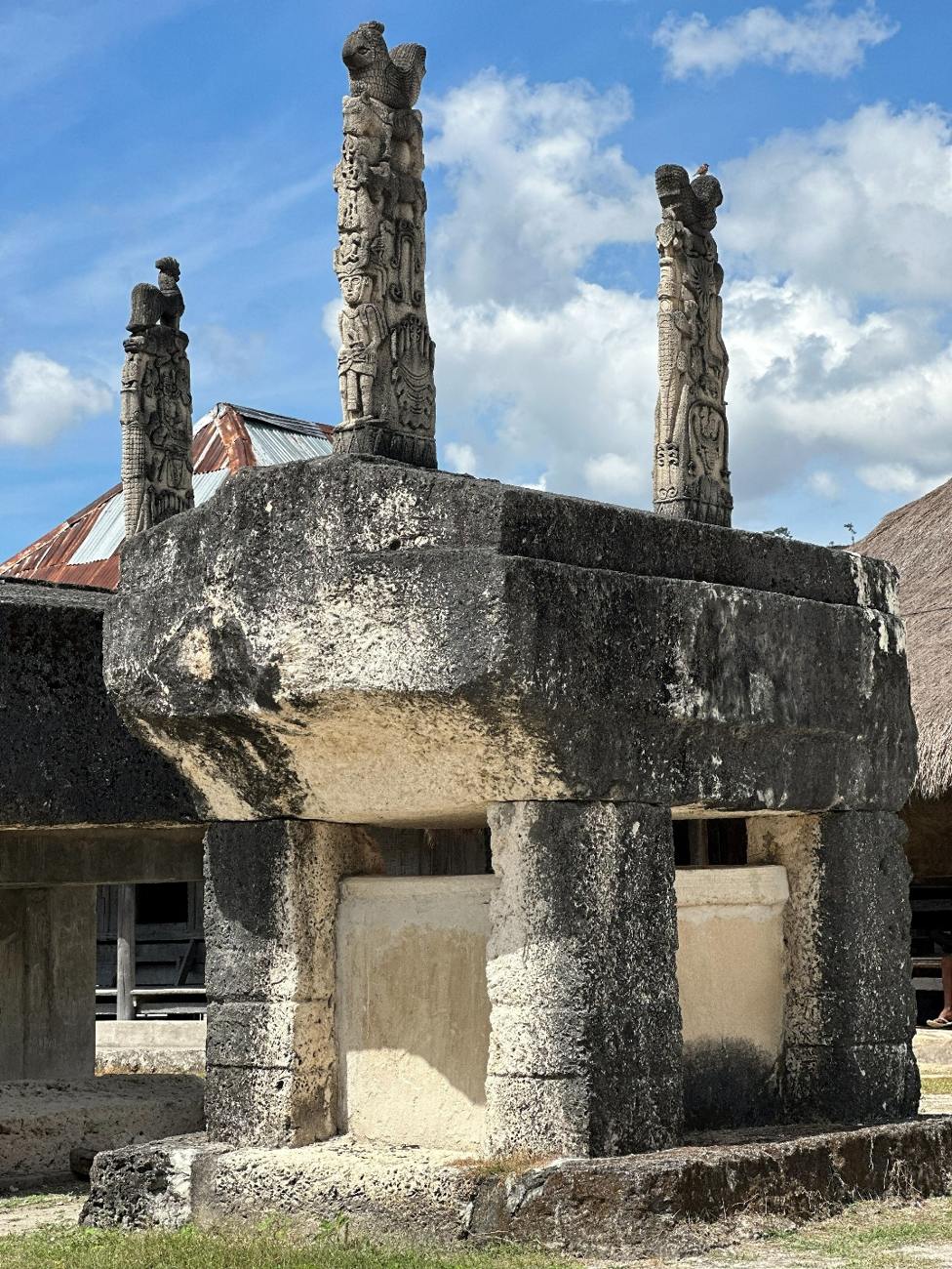 Carved ancestral stone tomb in a traditional Sumba village